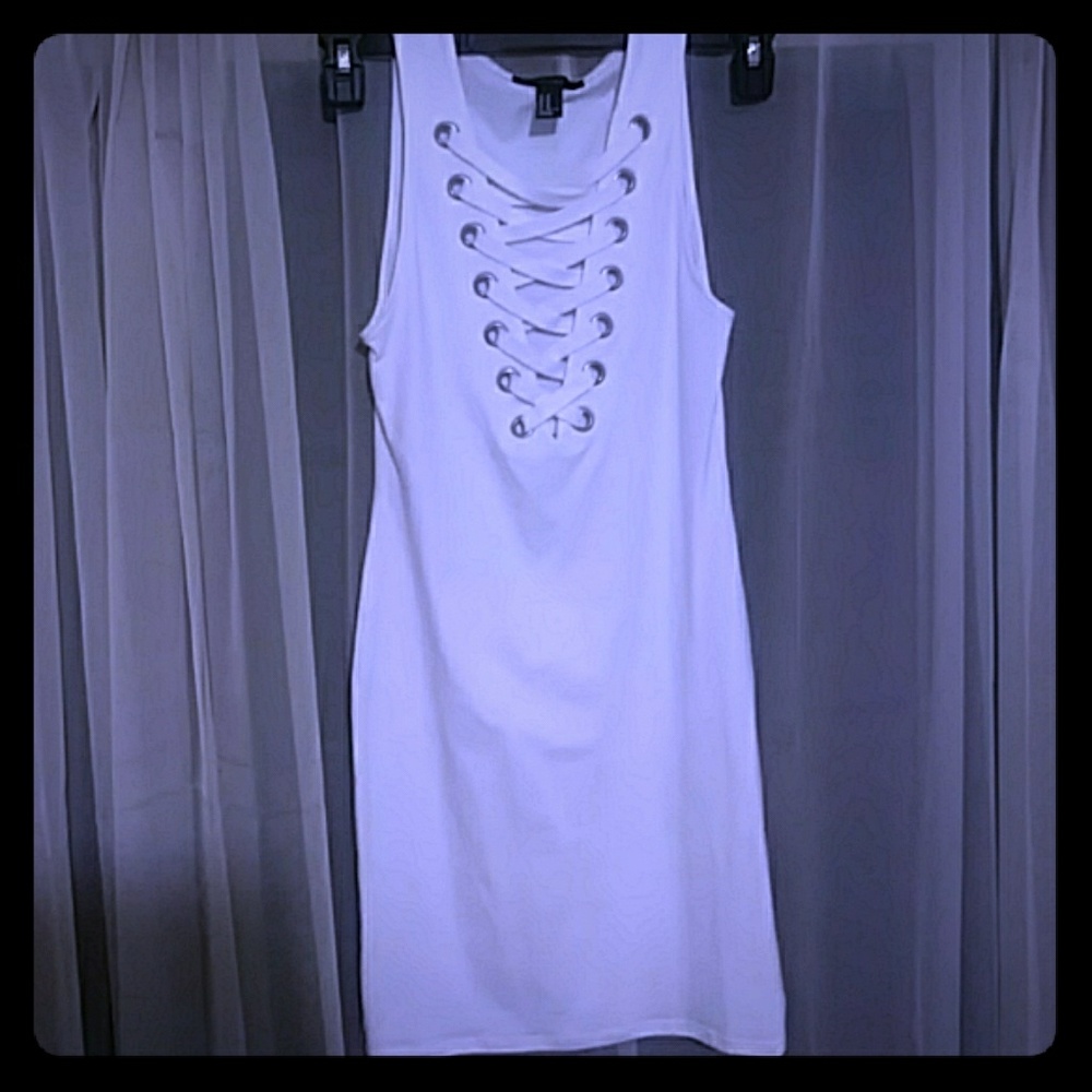 A sexy white short criss cross front bodycon dress